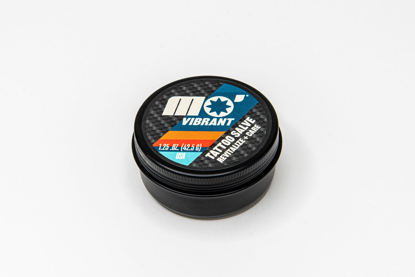 Mo’Handsome black tin of tattoo salve—clean, high-performance formula for soothing and protecting fresh ink.